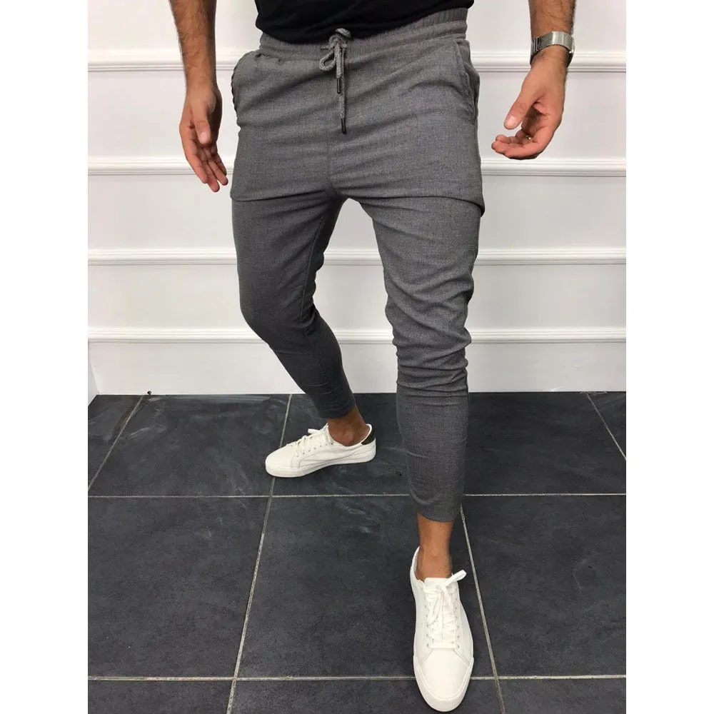 Lace-up casual jogging pants in solid light grey, nine points length, mid-waist, with adjustable front laces
