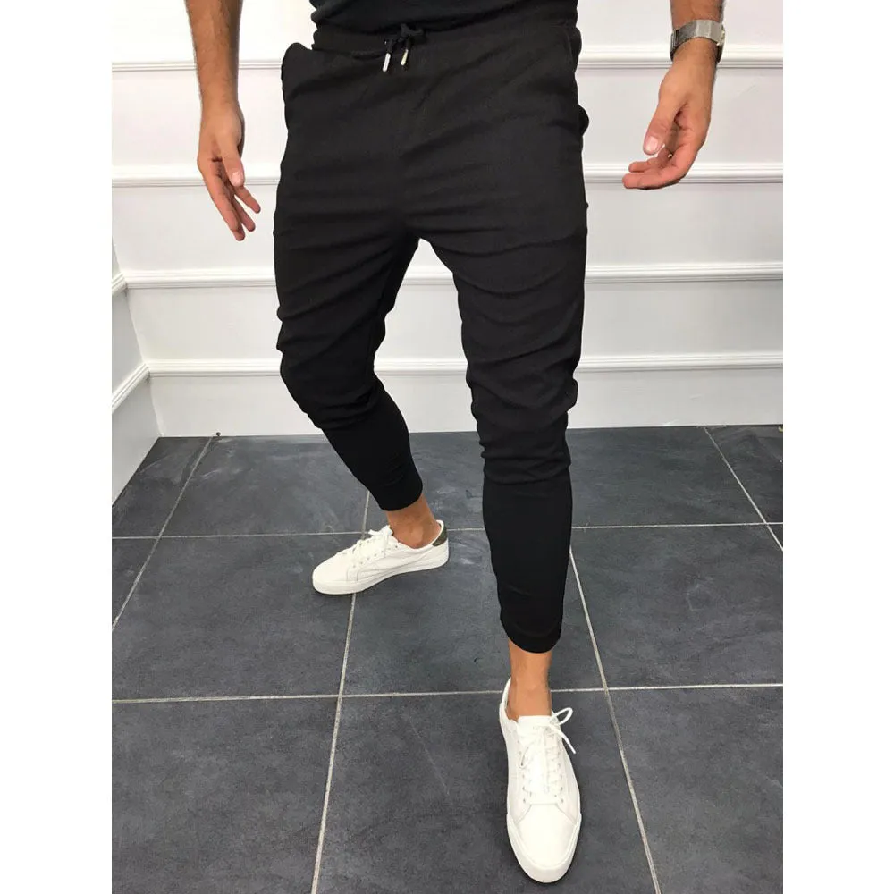 Lace-up casual jogging pants in solid light grey, nine points length, mid-waist, with adjustable front laces