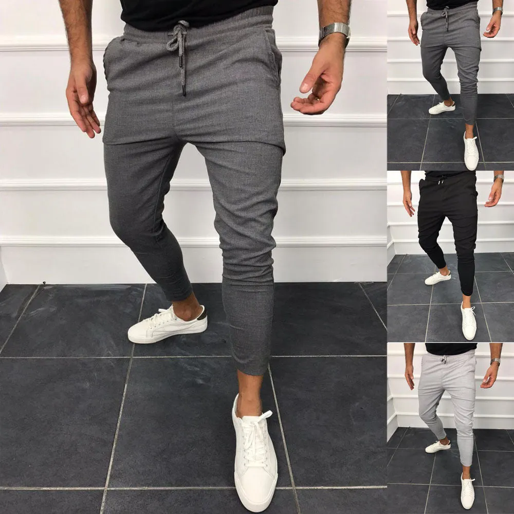Lace-up casual jogging pants in solid light grey, nine points length, mid-waist, with adjustable front laces