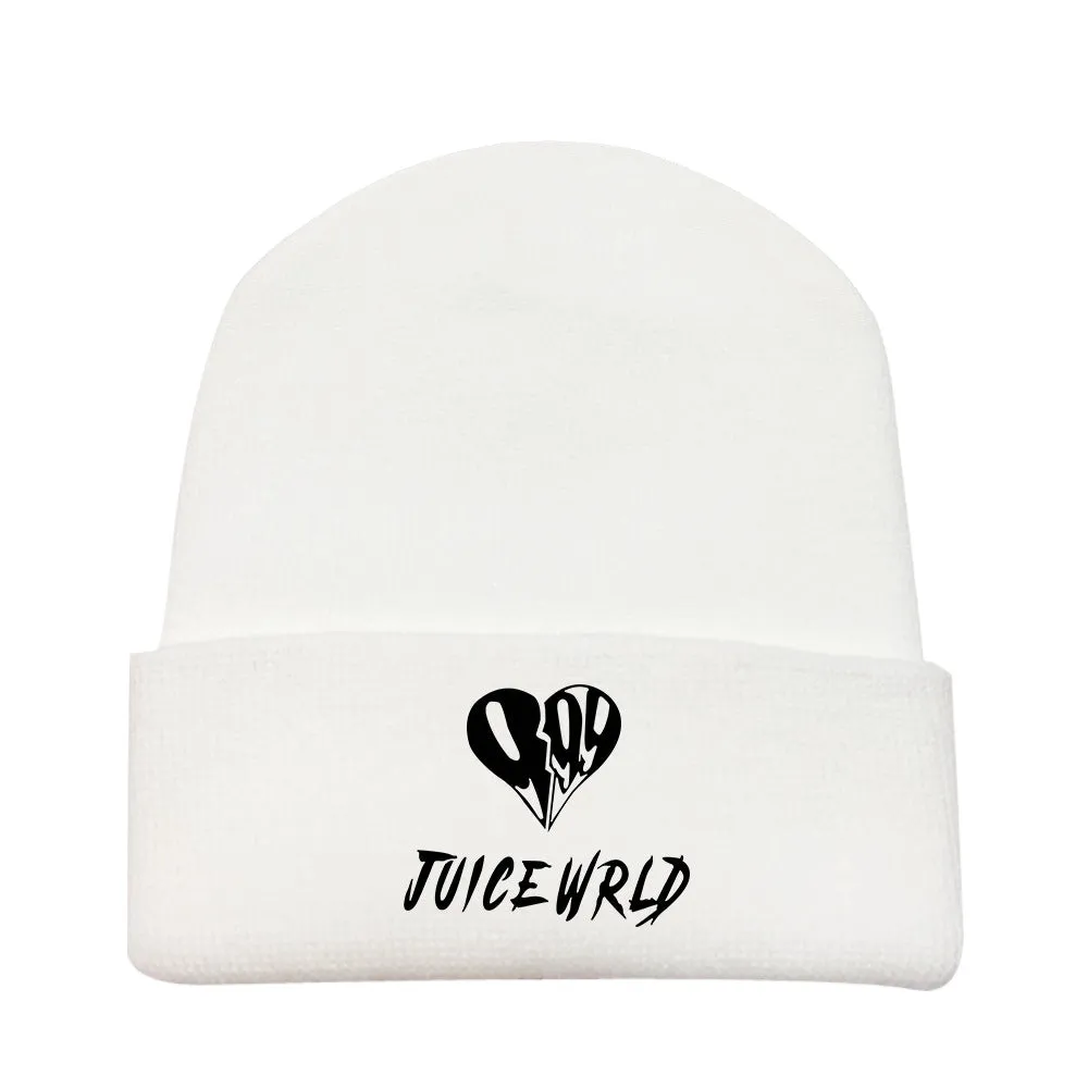 Wool knitted winter hat with flat top and curling brim in monochrome flower print