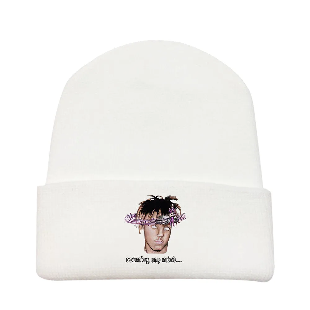 Wool knitted winter hat with flat top and curling brim in monochrome flower print