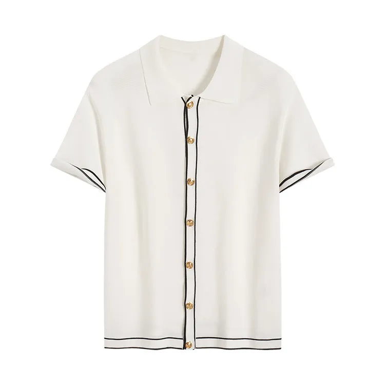 White short-sleeve women's V-neck cardigan with dark contrasting lapels laid flat.