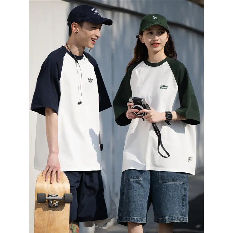 Blue loose-fit men's casual raglan sleeve T-shirt on a hanger