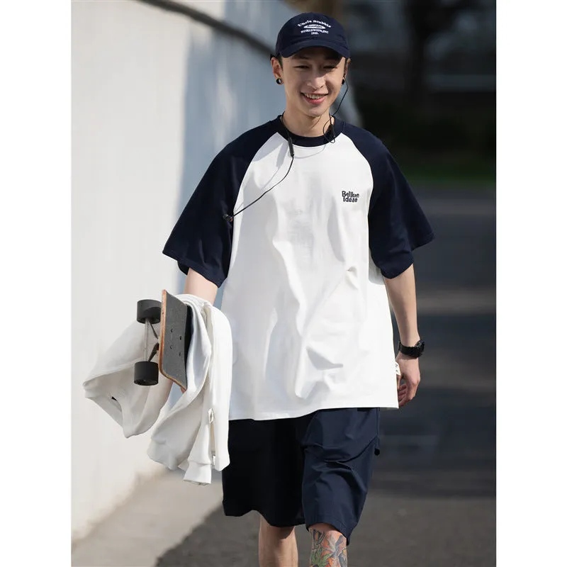 Blue loose-fit men's casual raglan sleeve T-shirt on a hanger