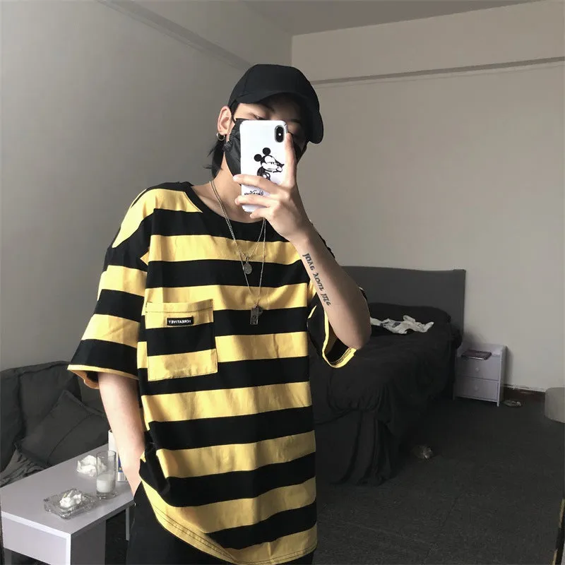 Striped short sleeve t-shirt in polyester fibre, available in blue and yellow, sizes L to XXL.
