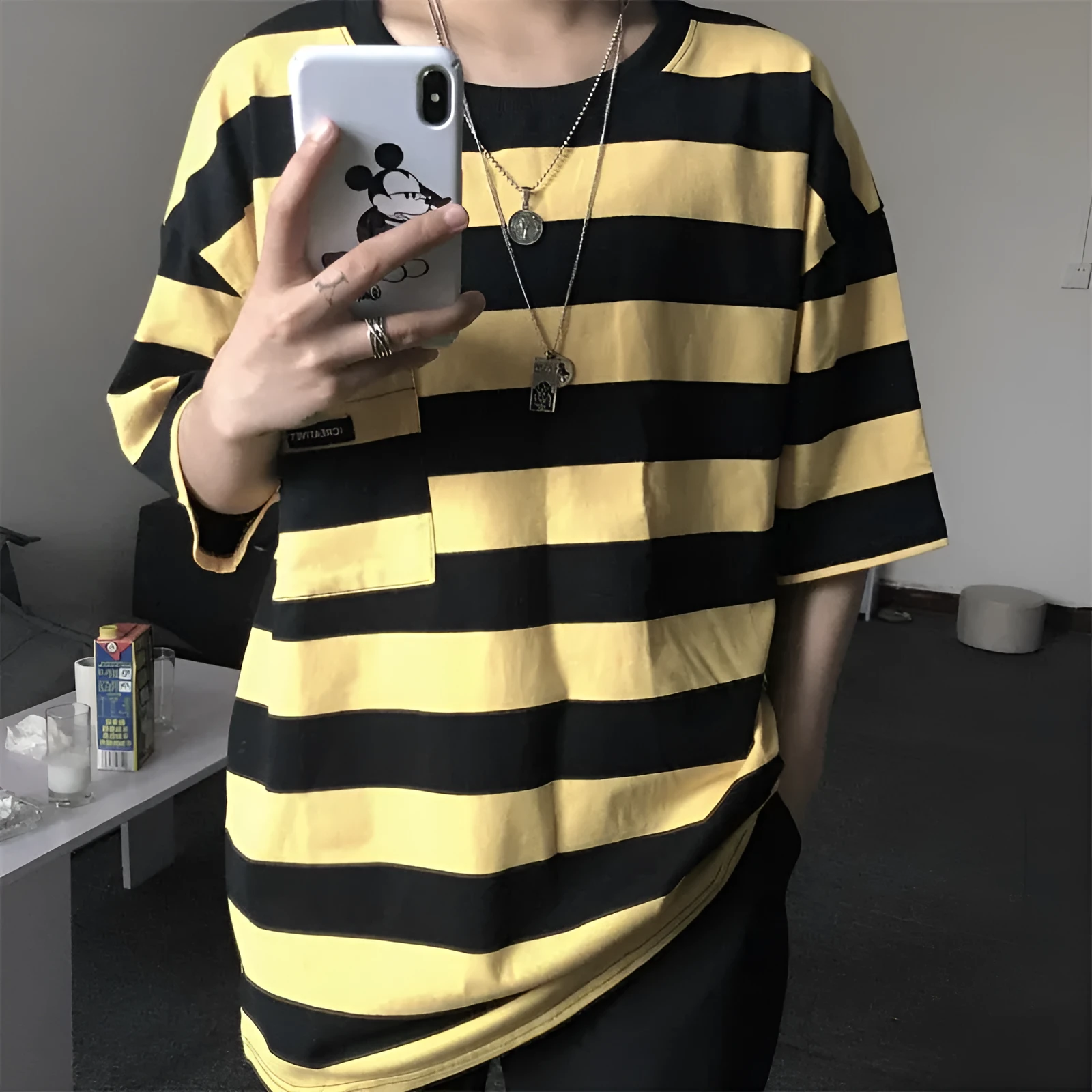Striped short sleeve t-shirt in polyester fibre, available in blue and yellow, sizes L to XXL.
