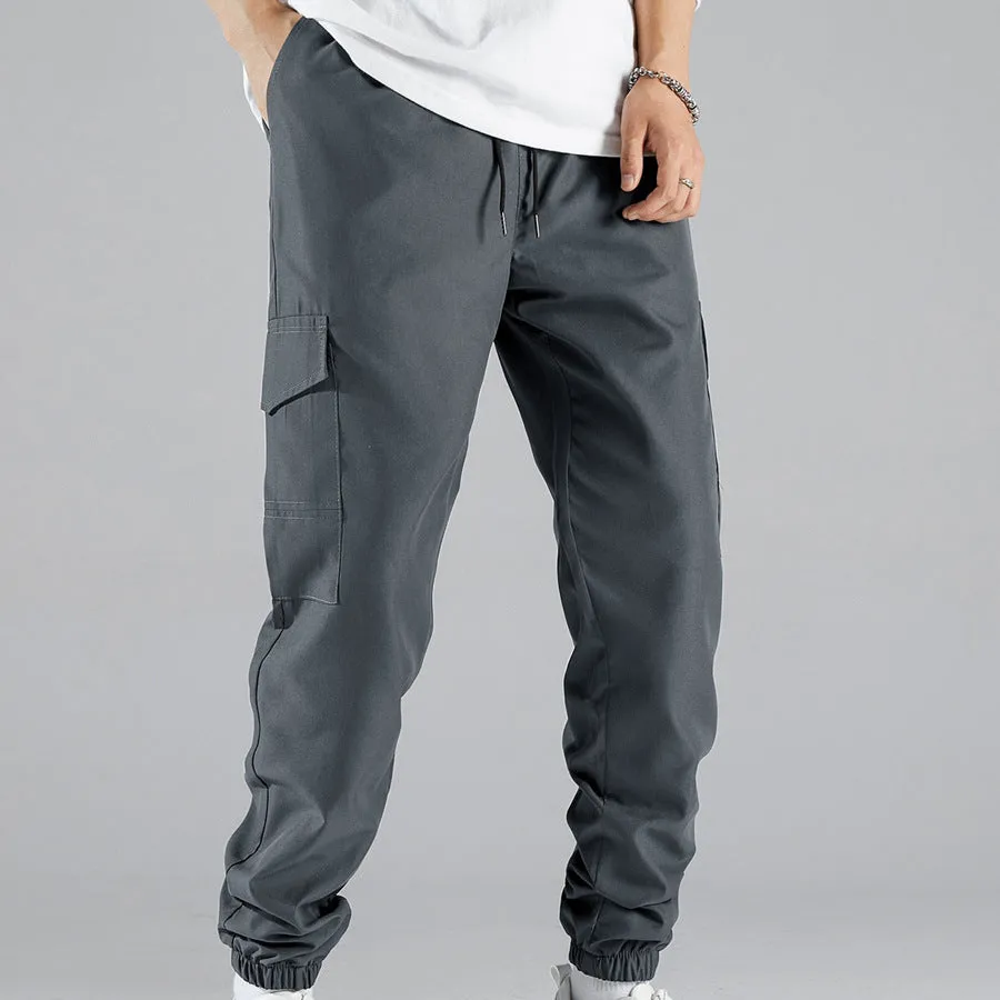 Men's multi-pocket workwear trousers in army green with drawstring waist, side and back pockets, straight leg cut