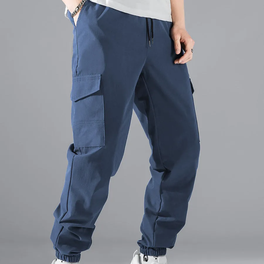 Men's multi-pocket workwear trousers in army green with drawstring waist, side and back pockets, straight leg cut