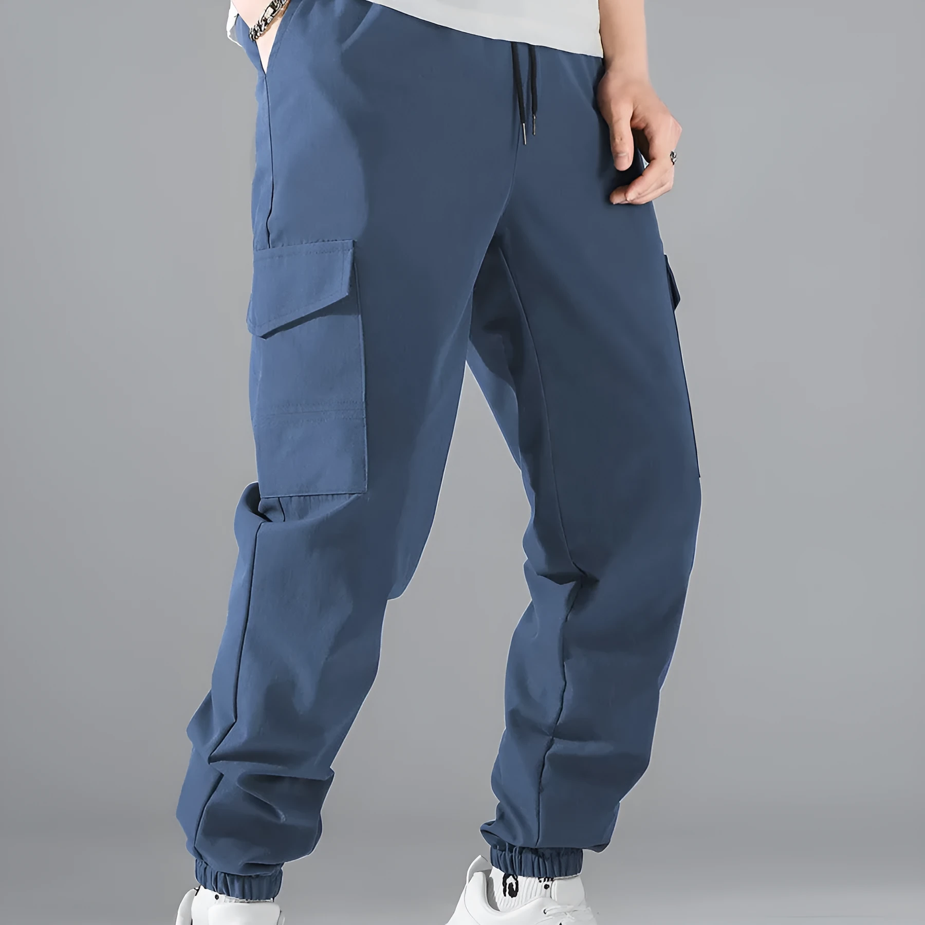 Men's multi-pocket workwear trousers in army green with drawstring waist, side and back pockets, straight leg cut
