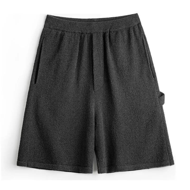Cement grey straight leg sports shorts with a loose fit and elasticated waistband on a neutral background.