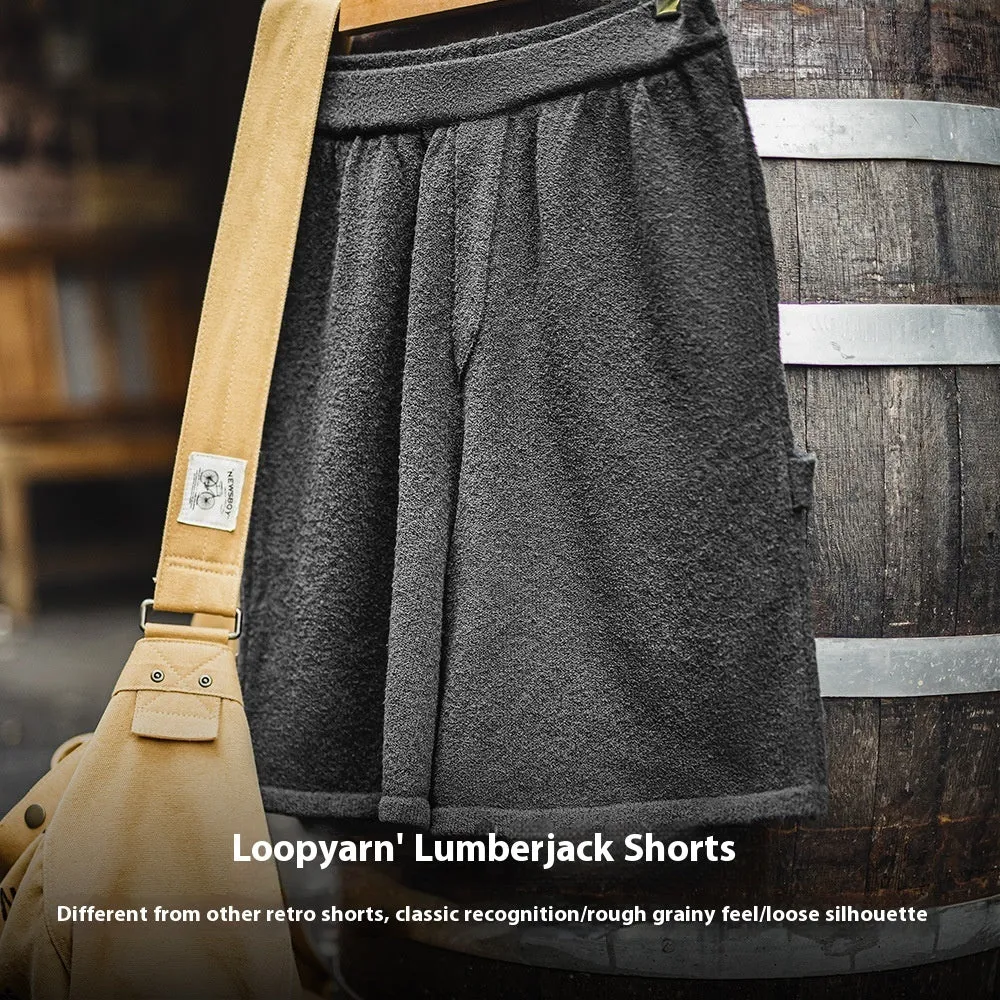 Cement grey straight leg sports shorts with a loose fit and elasticated waistband on a neutral background.