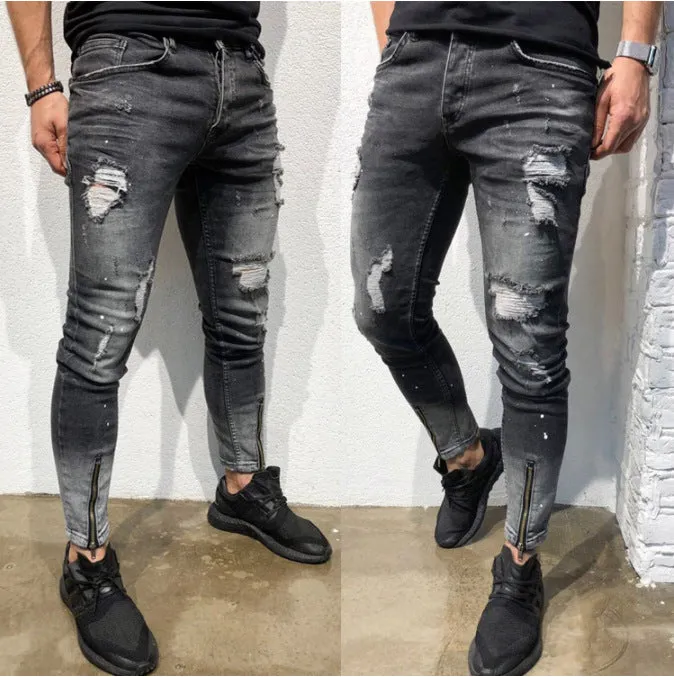 Men's black ripped denim jeans with zipper and elasticated ankle cuffs, shown flat on surface.