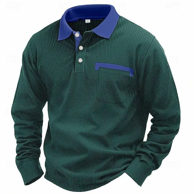 Man wearing a dark grey long-sleeved waffle-texture polo shirt with an asymmetric design detail.