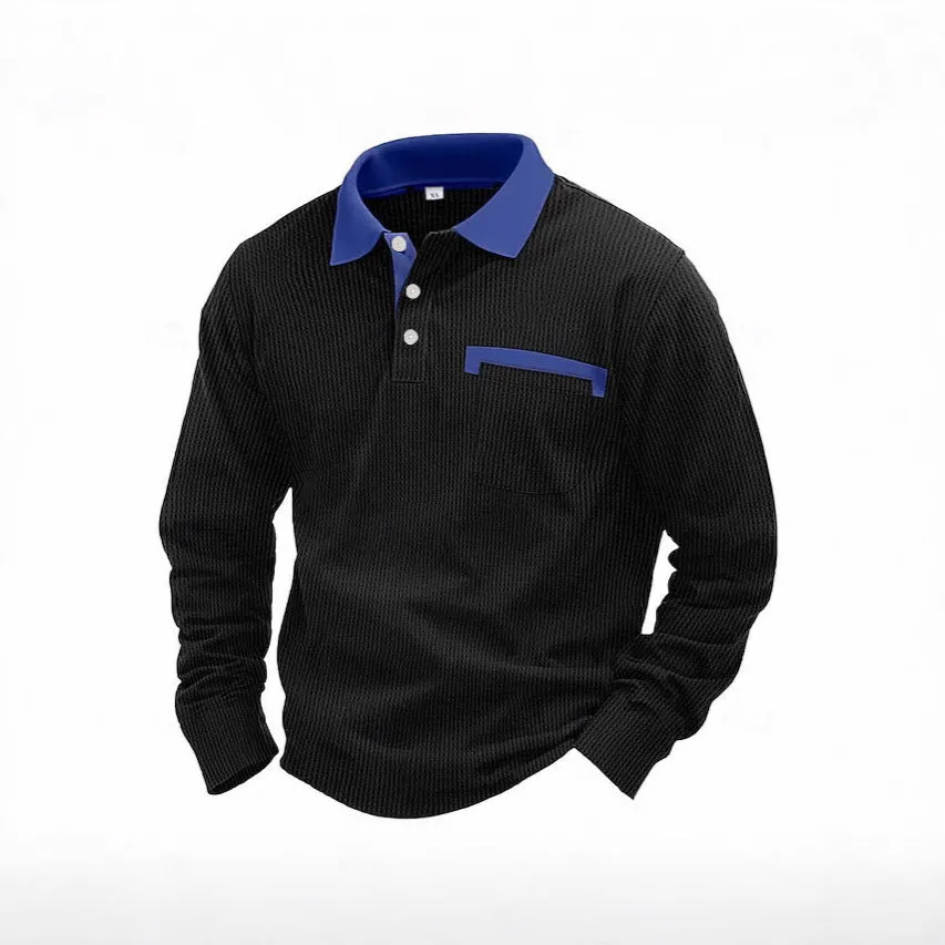 Man wearing a dark grey long-sleeved waffle-texture polo shirt with an asymmetric design detail.