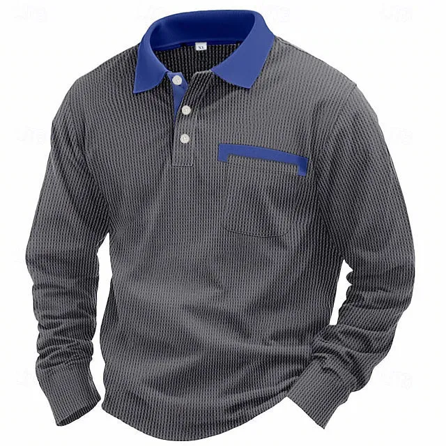 Man wearing a dark grey long-sleeved waffle-texture polo shirt with an asymmetric design detail.