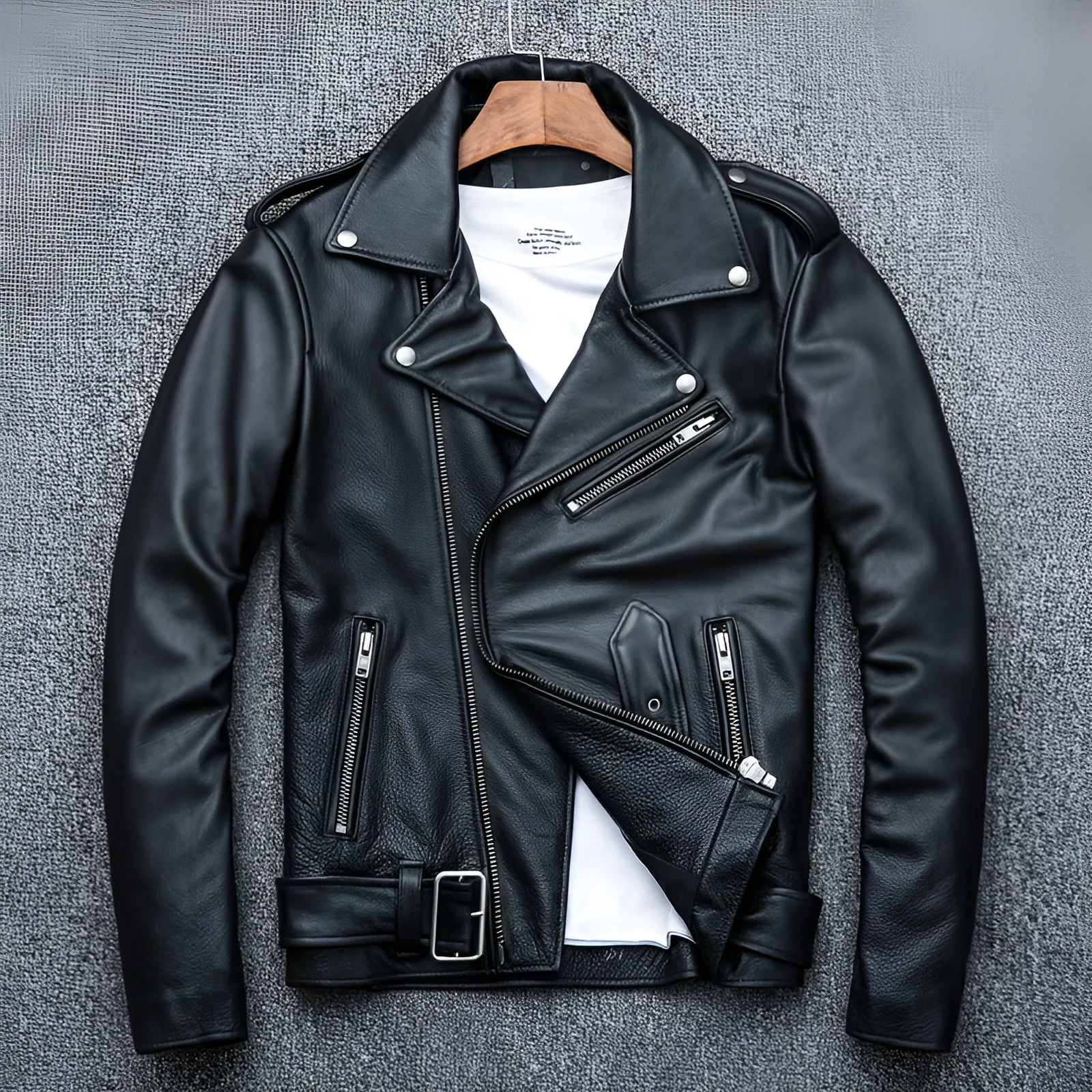 Pure cowhide biker's leather jacket in black with front zip and snap collar, full-length sleeves, polyester lining