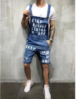 Men's black braces ripped jeans jumpsuit with adjustable shoulder straps on a model