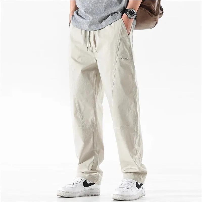 Beige cotton wide-leg casual trousers with elasticated waistband displayed flat