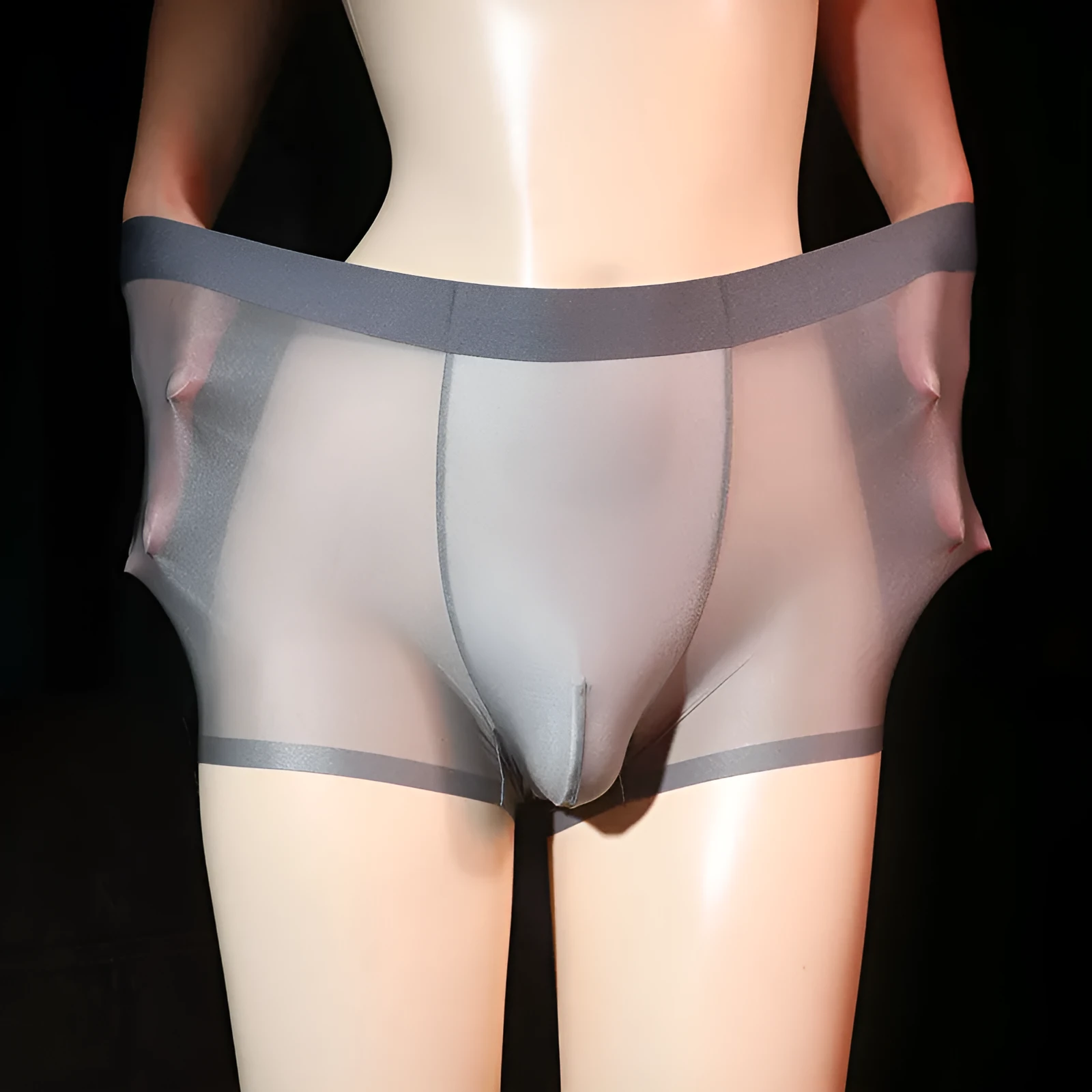 Men's ultra-thin transparent ice silk boxer shorts in light grey, shown flat.