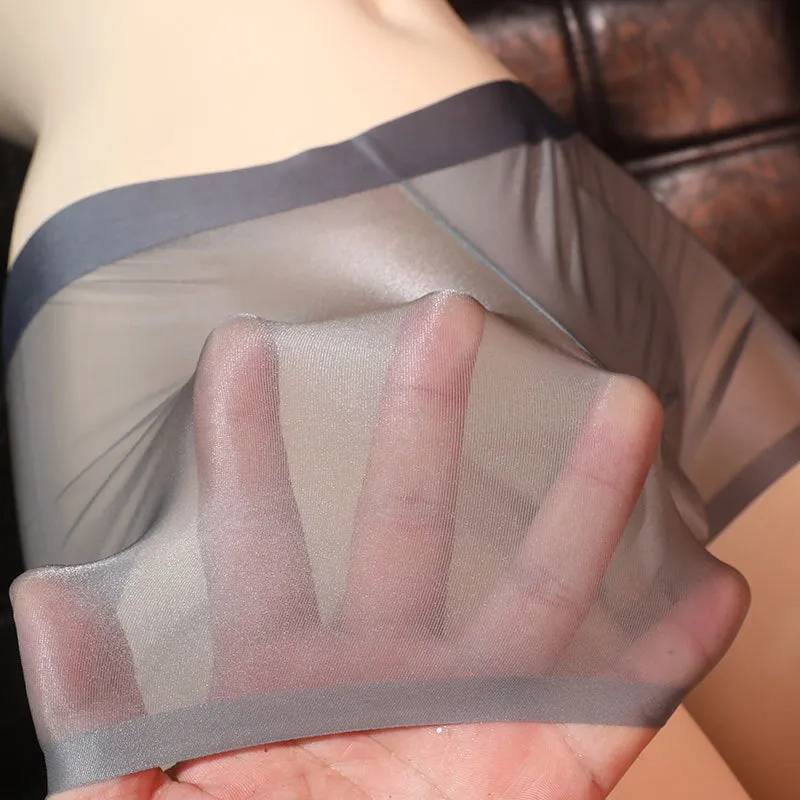 Men's ultra-thin transparent ice silk boxer shorts in light grey, shown flat.
