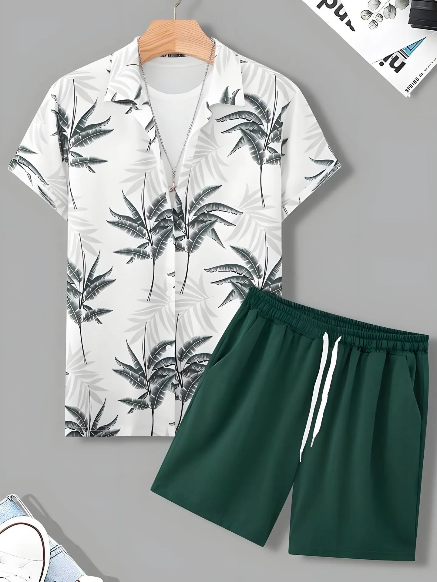 Black and white striped Hawaiian men's pullover shirt and shorts set on a model, loose fit, short sleeves.