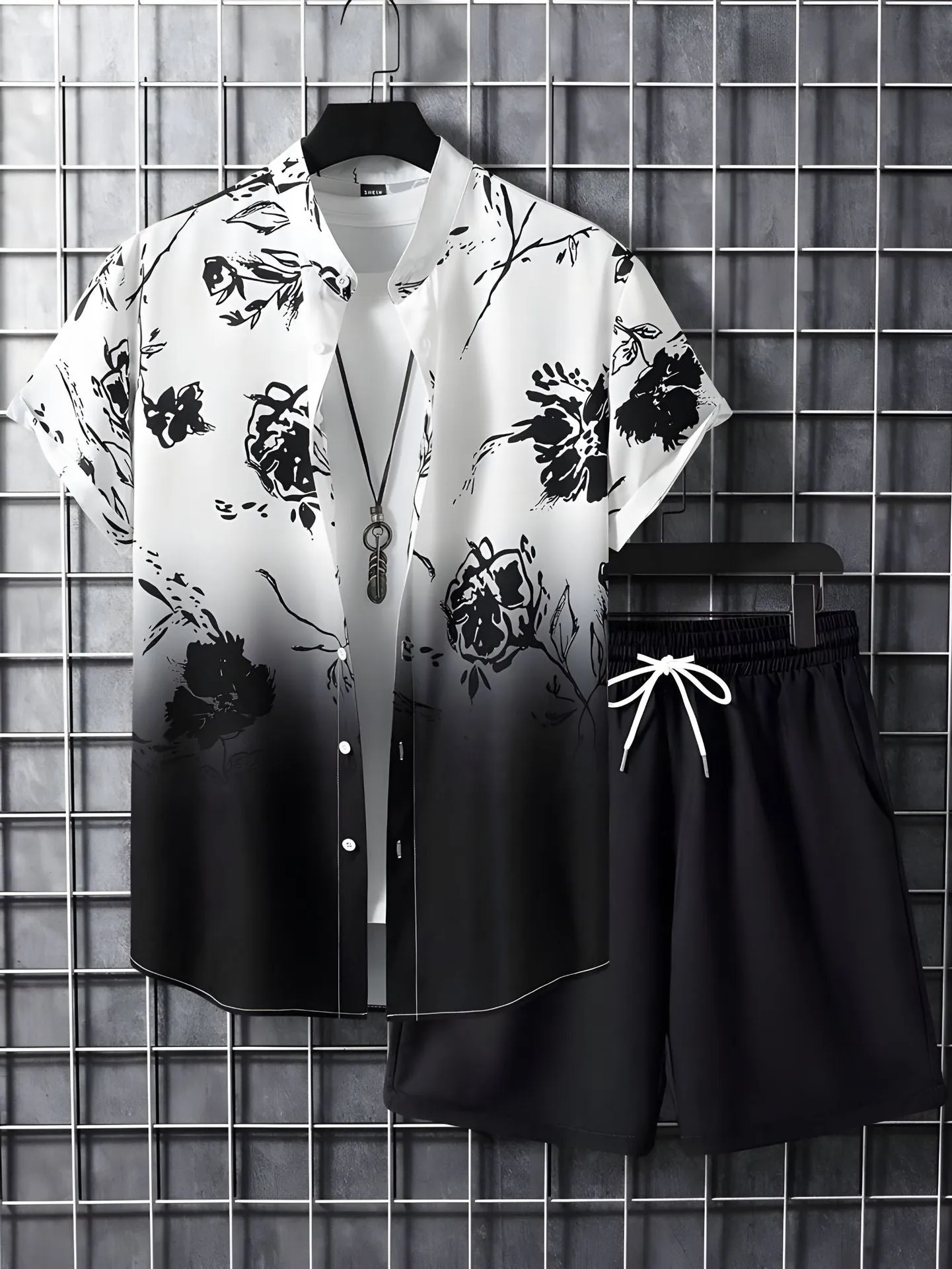 Black and white striped Hawaiian men's pullover shirt and shorts set on a model, loose fit, short sleeves.