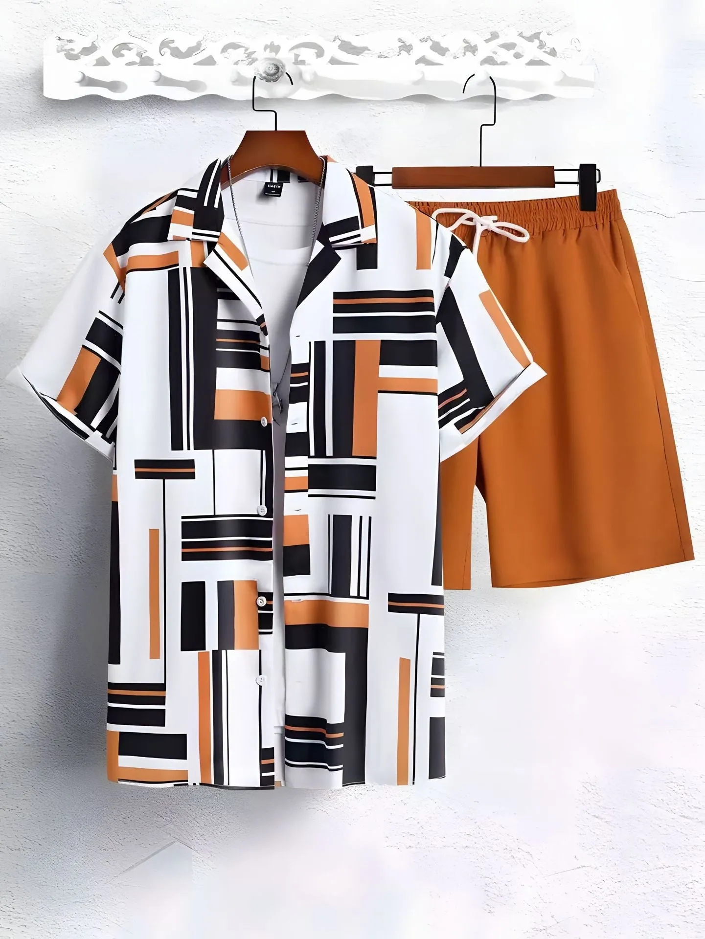 Black and white striped Hawaiian men's pullover shirt and shorts set on a model, loose fit, short sleeves.