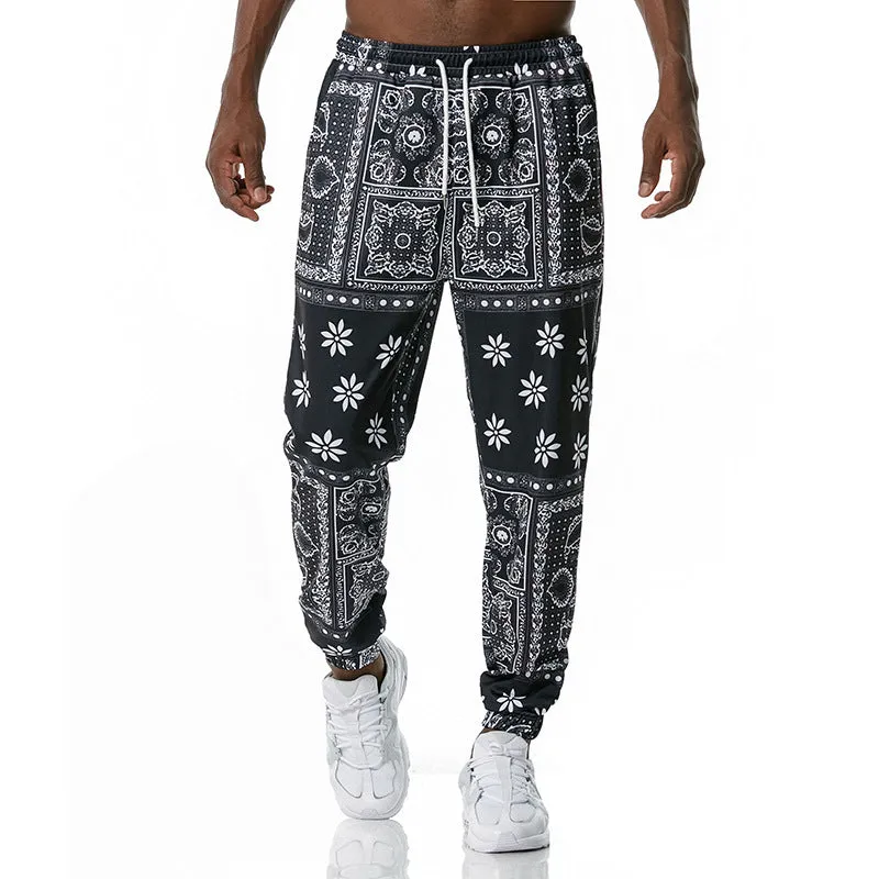 Printed jogging pants in loose fit with drawstring waist, small leg opening, and ribbed hem, available in multiple colours