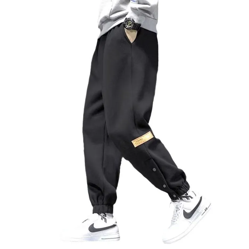Velvet padded casual trousers for women in regular black with ankle strap and skinny leg style
