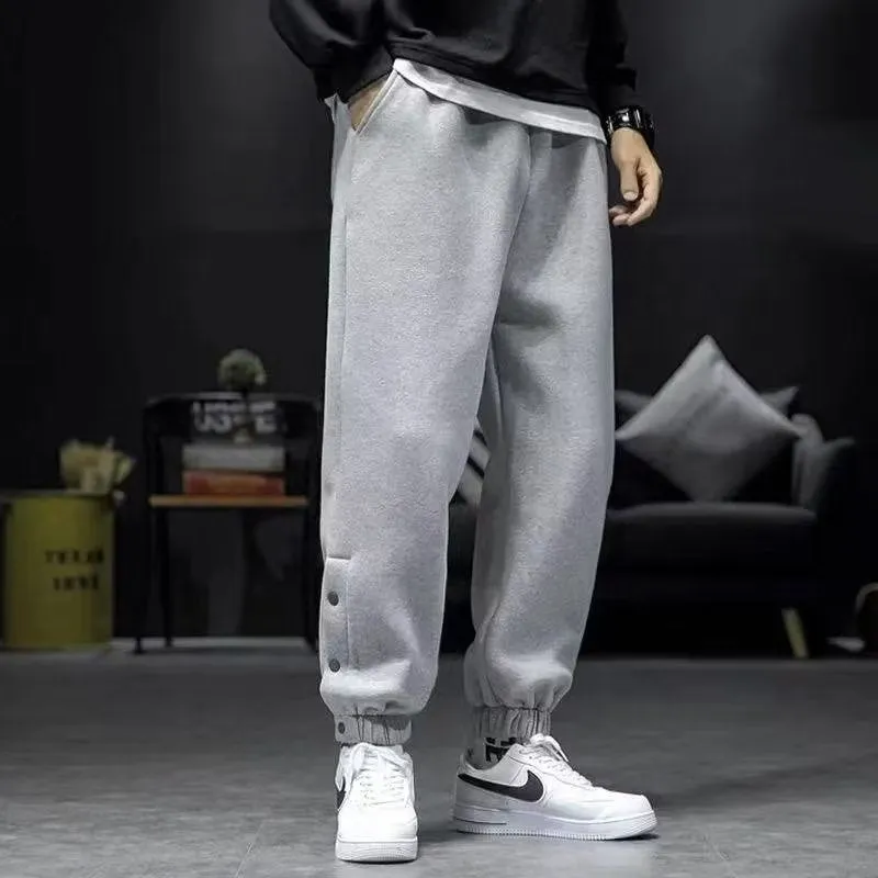 Velvet padded casual trousers for women in regular black with ankle strap and skinny leg style