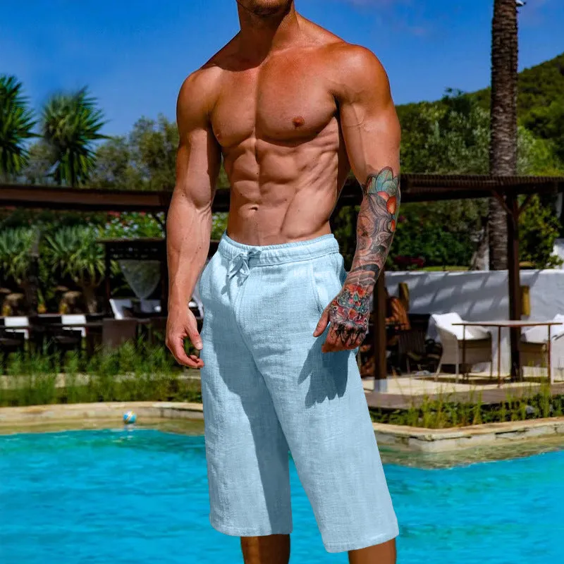 Men's loose linen blend cropped pants in khaki, shown on model, mid-waist straight leg