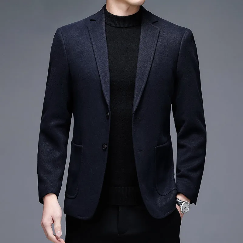 Men's solid colour woolen suit jacket with loose fit and round hem in winter setting.