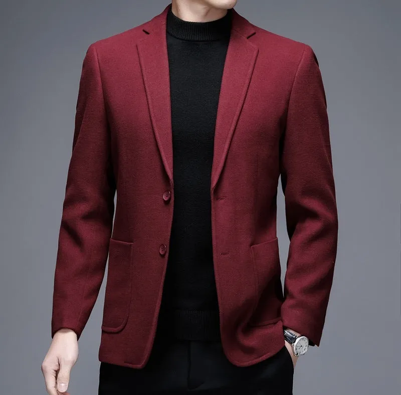 Men's solid colour woolen suit jacket with loose fit and round hem in winter setting.