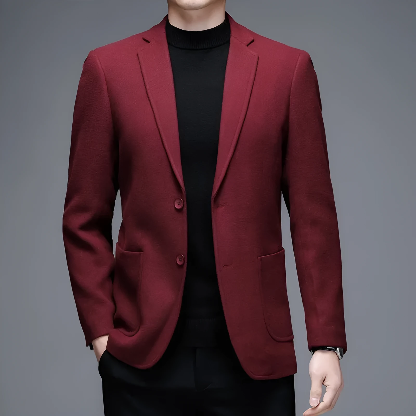 Men's solid colour woolen suit jacket with loose fit and round hem in winter setting.