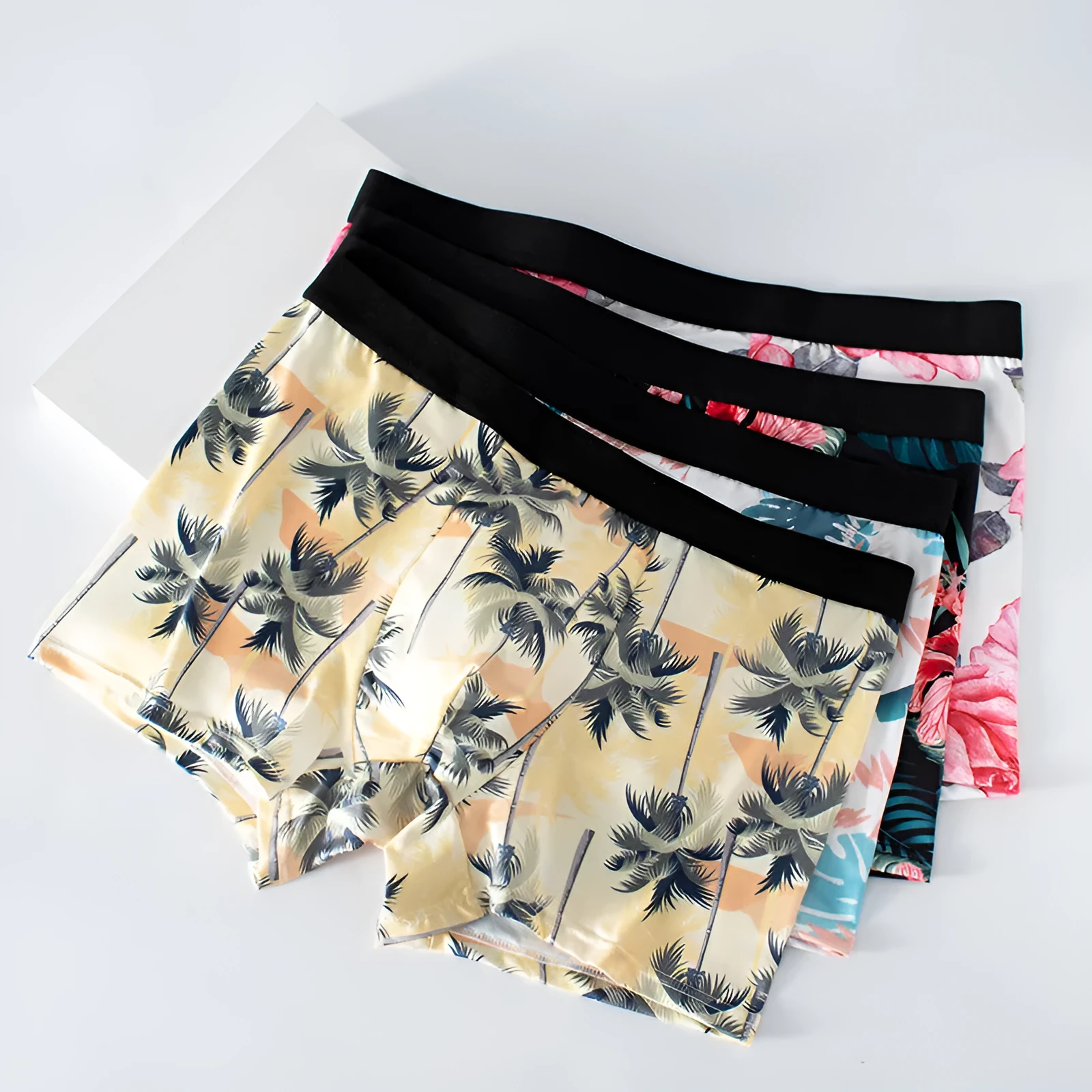 Men's printed ice silk underwear in floral pattern showing mid-waist design