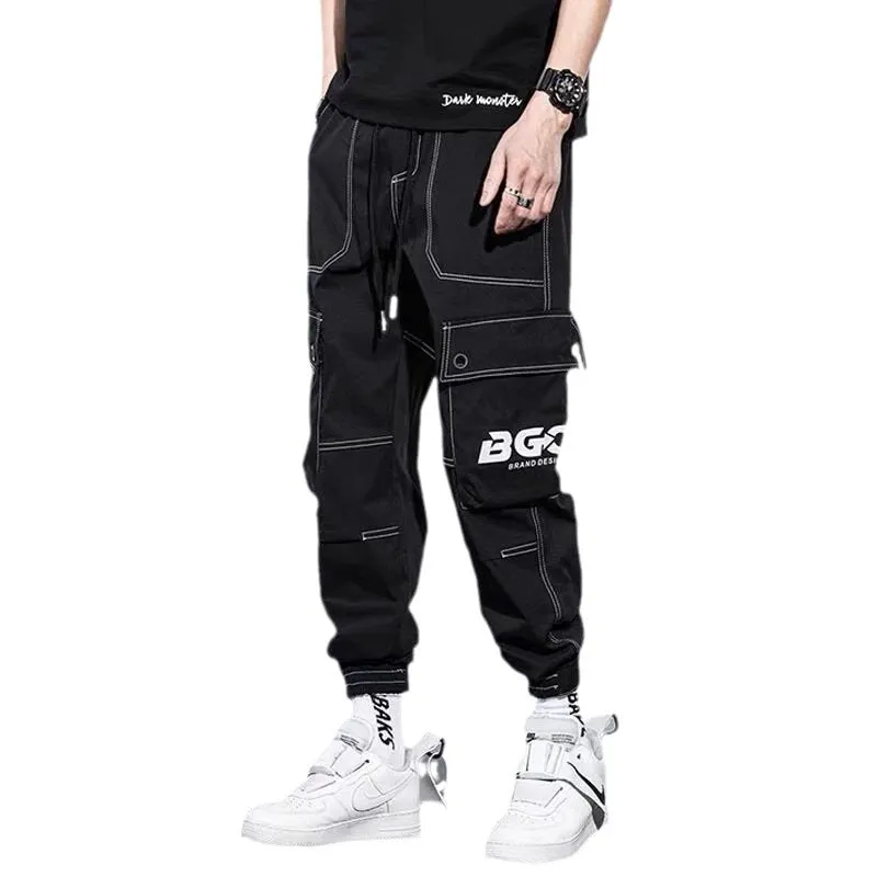 Men's loose fit solid colour polyester trousers in gray, front view, for casual autumn wear