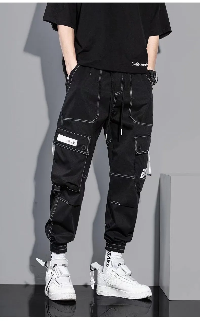 Men's loose fit solid colour polyester trousers in gray, front view, for casual autumn wear