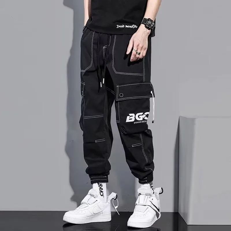 Men's loose fit solid colour polyester trousers in gray, front view, for casual autumn wear