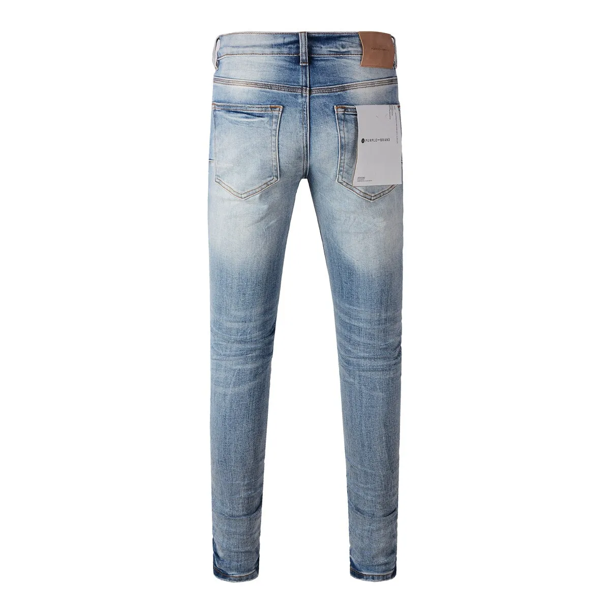 Men's blue denim pencil leg jeans with low waist and zipper fly on a person standing