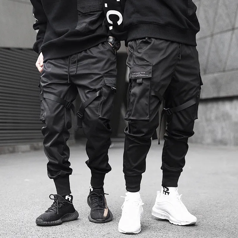 Black 100% cotton overall trousers with tapered leg, front view, on a plain background.