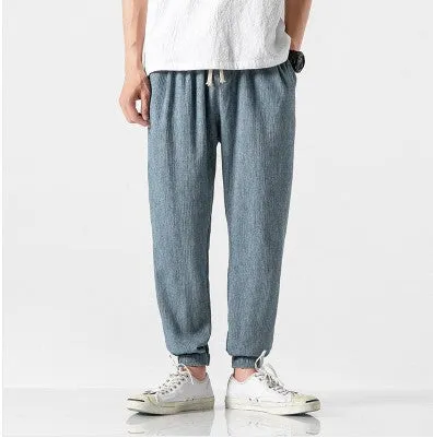 Men's cotton linen harem trousers in beige, shown with elastic waistband and tapered legs, available in multiple sizes and colours