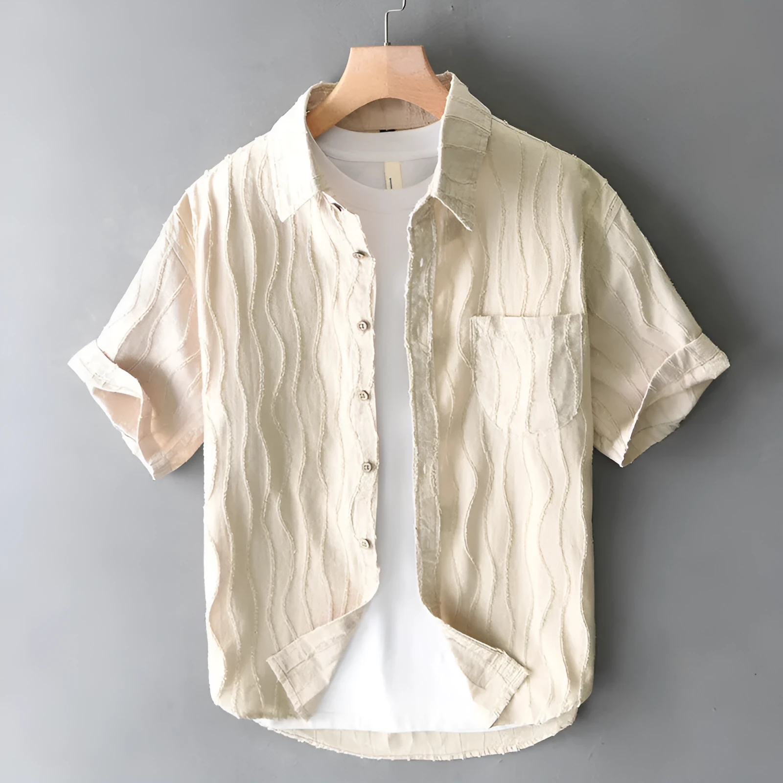 Men's apricot pure cotton loose short sleeve casual shirt on a hanger