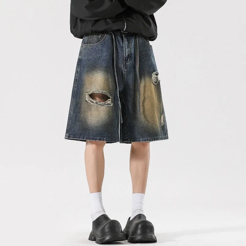 Retro blue loose fit ripped jeans with distressed detailing on denim fabric