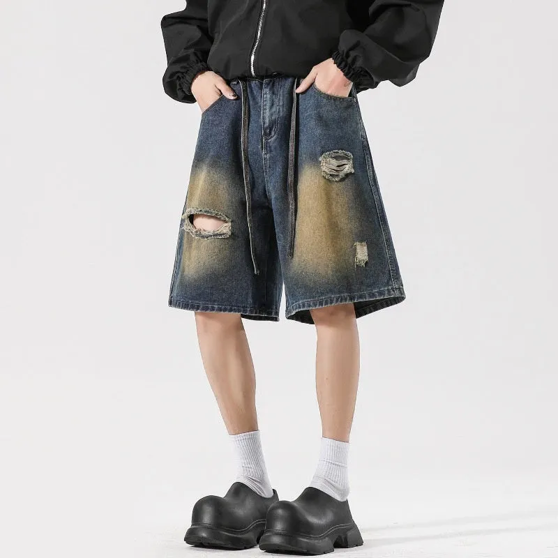 Retro blue loose fit ripped jeans with distressed detailing on denim fabric
