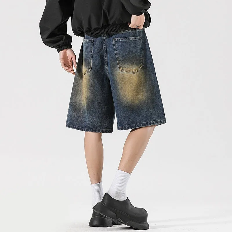 Retro blue loose fit ripped jeans with distressed detailing on denim fabric