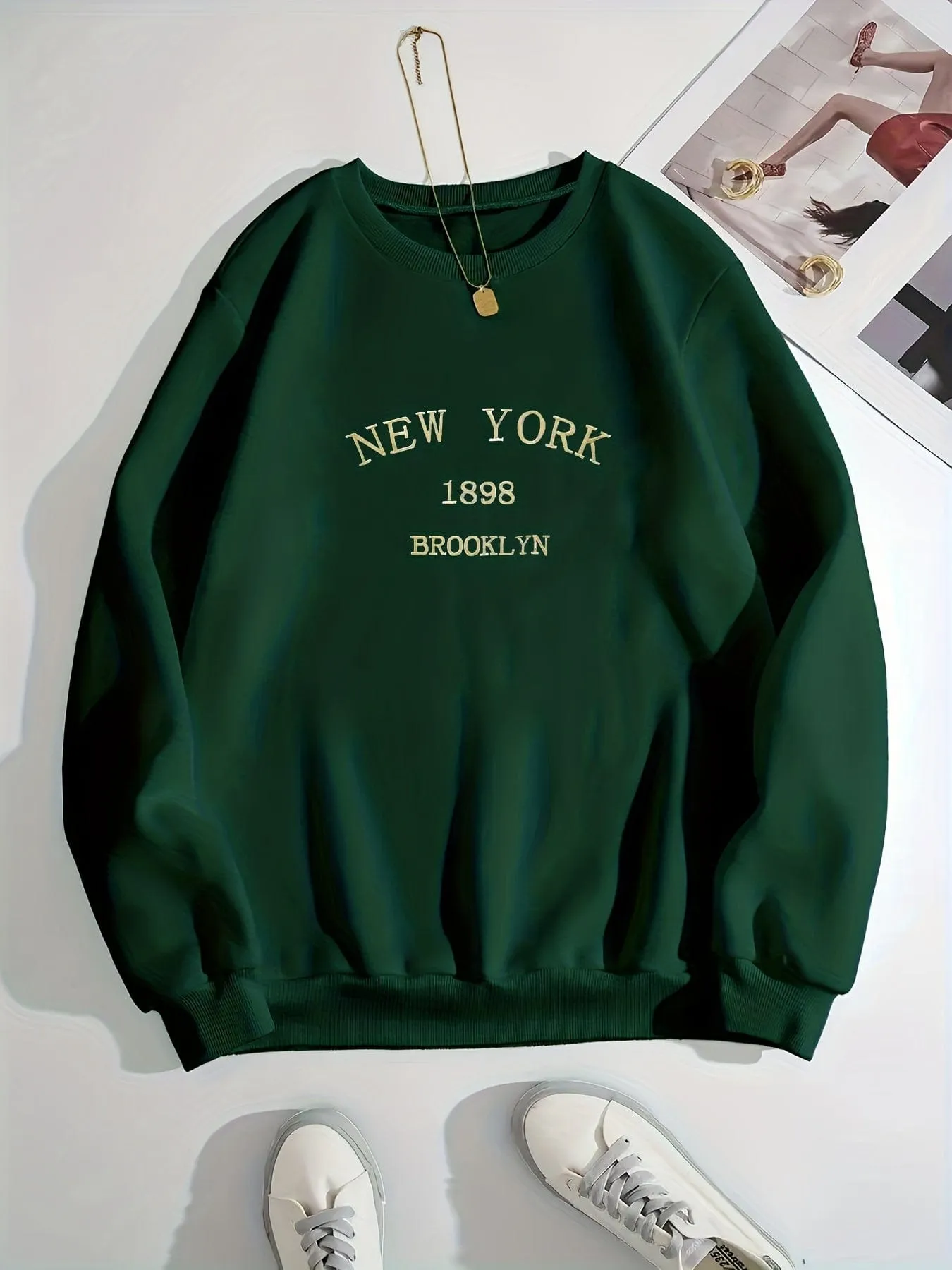 Loose round neck pullover top in green polyester with long sleeves, available in sizes XS to 5XL