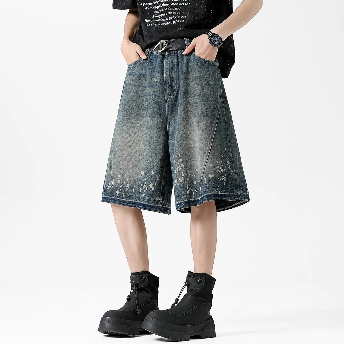 Retro blue washed denim shorts for men with a splash ink pattern and ripped detailing on the legs.