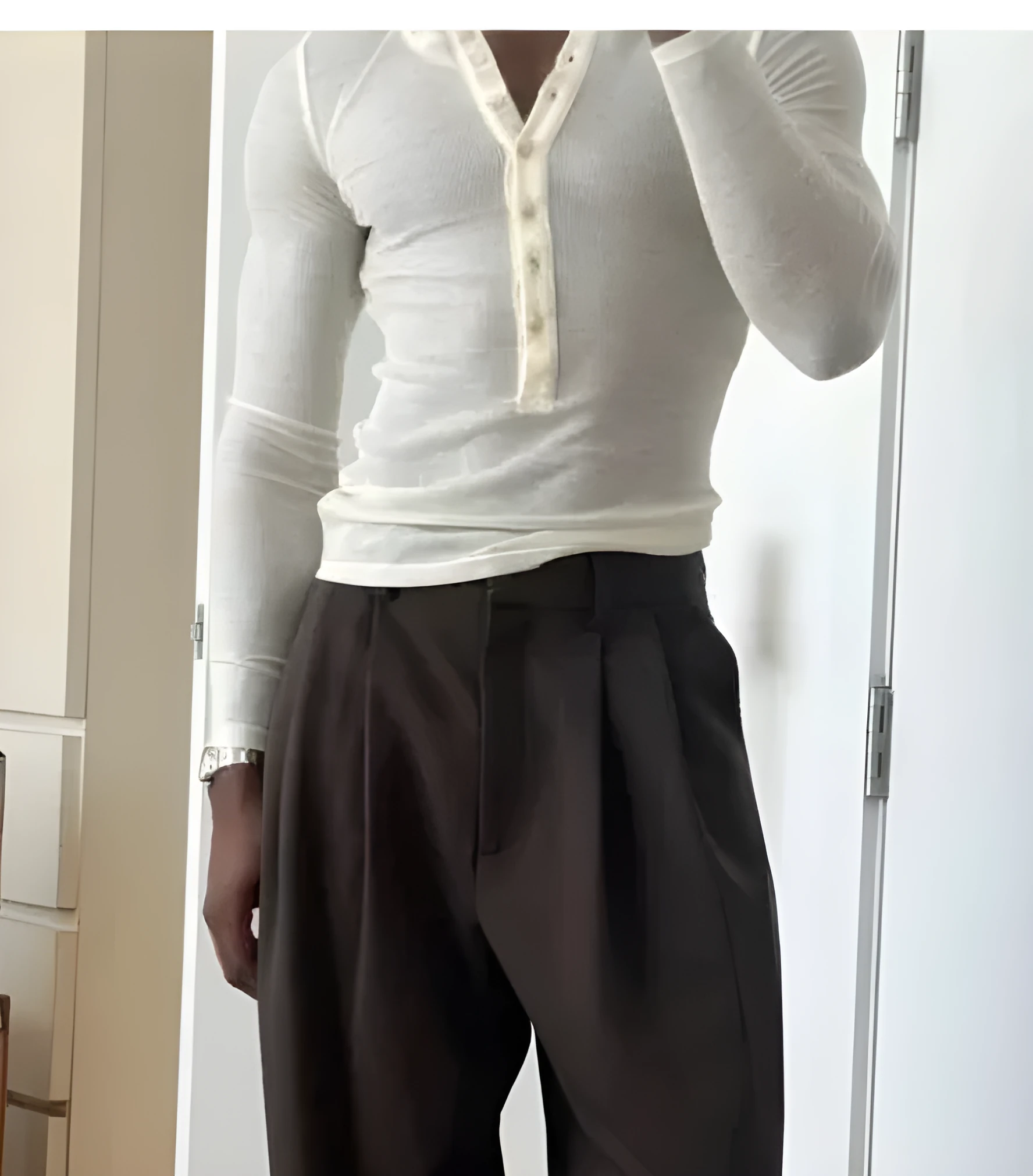 Men's cream-coloured ribbed long-sleeve henley top with a three-button placket.