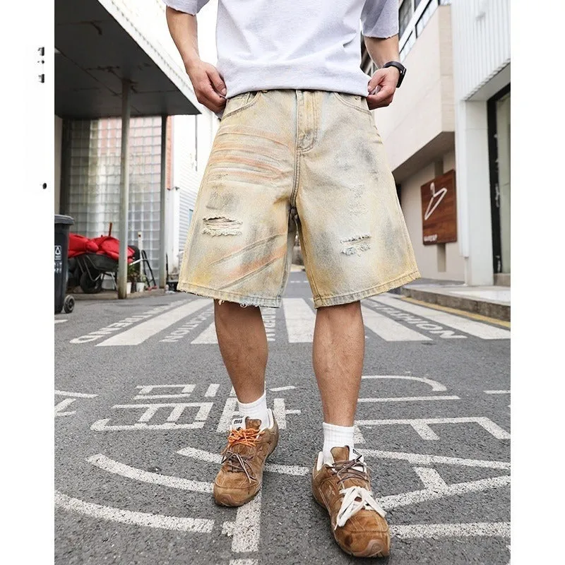 Men's light blue denim shorts with ripped detailing and a straight-leg cut.