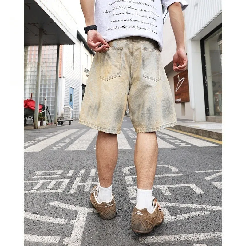 Men's light blue denim shorts with ripped detailing and a straight-leg cut.